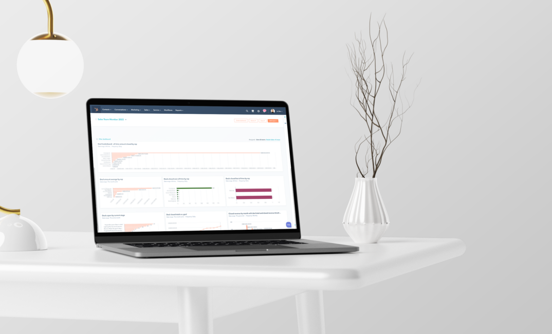 A Laptop sitting on a desk with the Hubspot dashboard on the screen