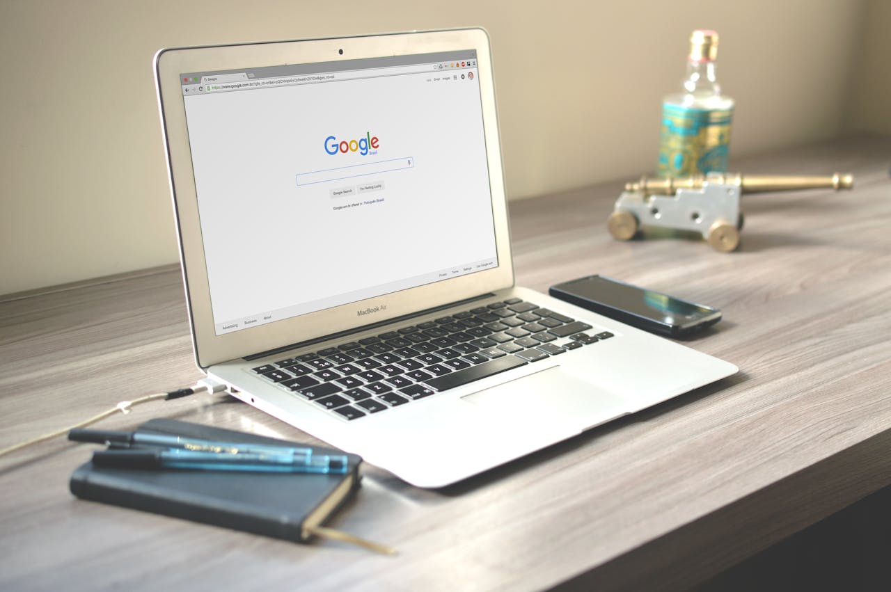 A Laptop on a desk with Google on the screen